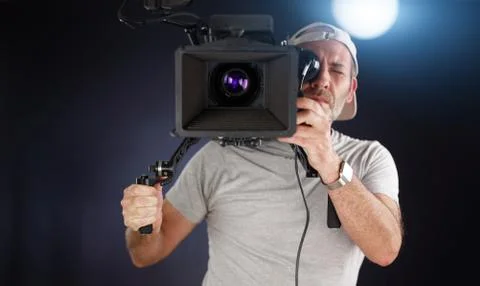 Camera operator working with a cinema camera Photos