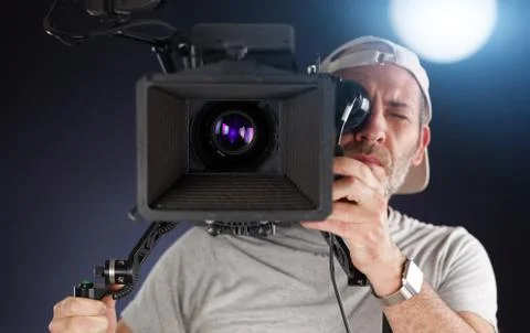 Camera operator working with a cinema camera Photos
