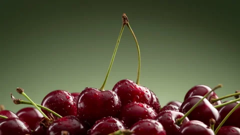 Camera orbit around fresh cherries with droplets. Stock Footage 328985783