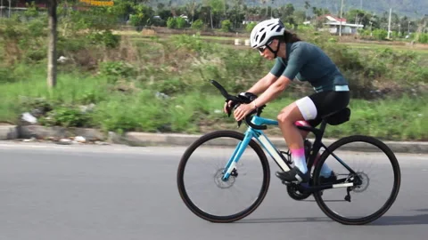 Camera overtakes athlete on bicycle. Stock Footage 285010106