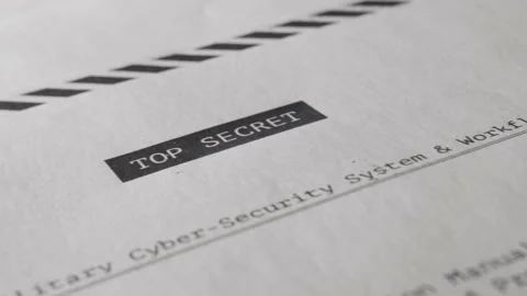 Camera pan across top secret document with confidential material and information Stock-Footage 138440285