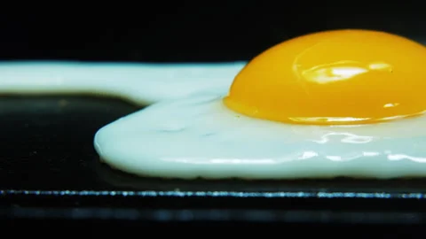 Camera pan and stop fried egg yolk cooked 4K Stock Footage 246555679