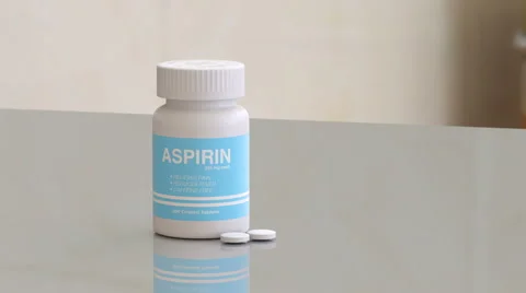 A camera pan on generic aspirin and aspirin bottle. Stock Footage 60147206