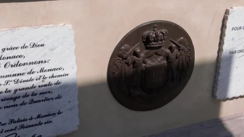 Camera pan of historic marble plaques on Prince Charles III monument in Monaco Stock Footage 337513823