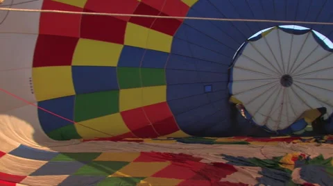 Camera pan of the inside of a hot air balloon as it fills with air 스톡 동영상 56246386