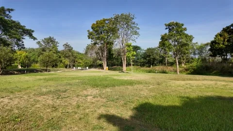 Camera pan to left at park against blue sky background. 스톡 동영상 259946261