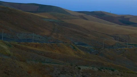 Camera pan from a mountainous road to city Stock Footage 70355276