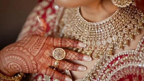 Camera pan over beautiful Gold necklace pakistani bridal getting ready her Vídeo Stock 296809831