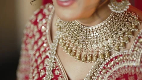 Camera pan over beautiful Gold necklace pakistani bridal getting ready her Vídeo Stock 296809835