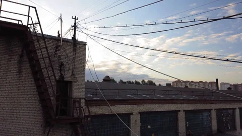 Camera pan from the rooftop of abandoned factory or plant around the industrial Vidéo 118042013