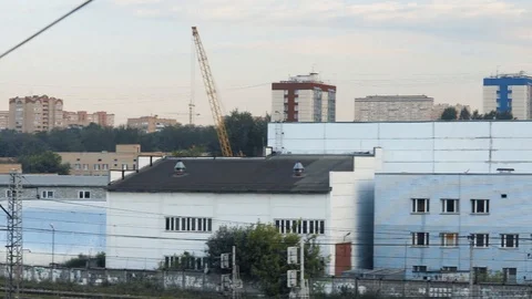 Camera pan from the rooftop of abandoned factory or plant around the industrial Vidéo 118042029