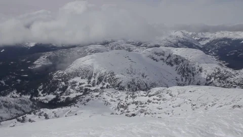 Camera pan on top of Rainbow Mountain To Helicopter Stock-Footage 76431954