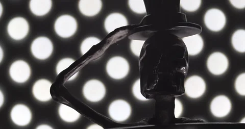 Camera panning across a metallic skeleton with a top hat. Stock Footage 117351055