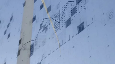 Camera panning across panel sliding printed data revealing rising line plot and Stock Footage 332731710
