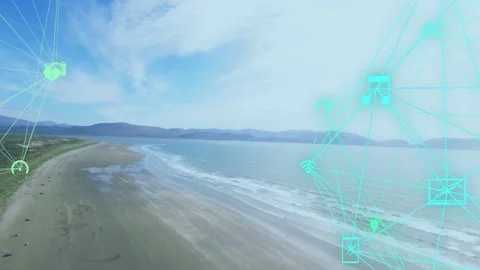 Camera panning along sandy coast, turquoise network fading in and drawing icons, Stock Footage 334351792