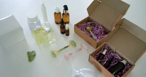 Camera panning and zooming on tabletop, revealing two kraft gift boxes with dark Stock Footage 341932469