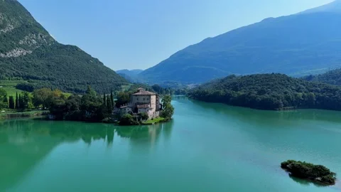 Camera panning around breathtaking lake toblino castle Stock Footage 283285266