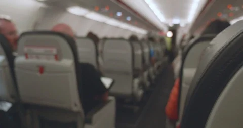 Camera panning from behind plane seat to the aisle 4K Stock-Footage 107404576