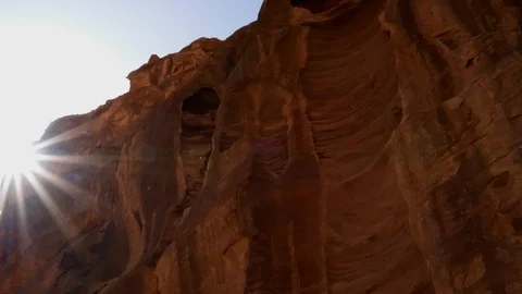 Camera panning in a circle in rock mountain canyonwith sun flare from the sky Stock-Footage 102503631