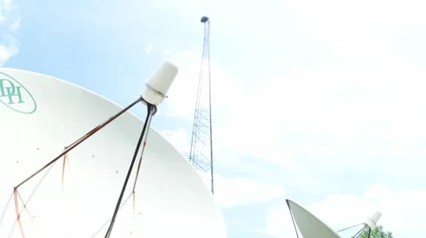 Camera Panning down from tower into satellite dishes Stock Footage 50966541