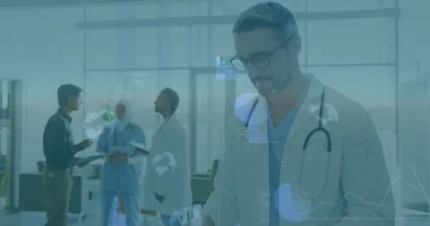 Camera panning foreground physician reviewing folder, raising head and smiling, Stock Footage 331820675
