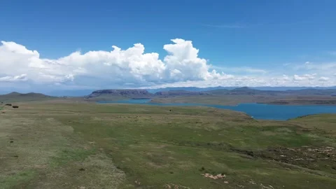 Camera panning left to right over the length of the Sterkfontein dam with the fo Stock Footage 325648978