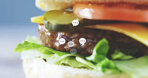 Camera panning left, speech-bubble icons rising as burger revealing layers Stock Footage 323336084