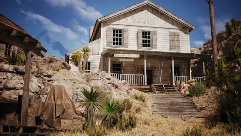 Camera is panning by an old western house of a west town village Stock Footage 236395737