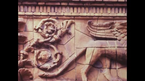 Camera panning over ancient babylonian style reliefs in paris Stock Footage 291050777
