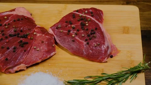 Camera panning over beef steak and cooking ingredients Video stock 188540584