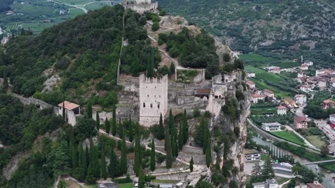 Camera panning over castel drena surrounded by italian alps Stock Footage 284984061