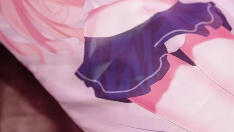 Camera panning over cute anime girl dakimakura hug pillow on bed 4K Vídeo Stock 160460913