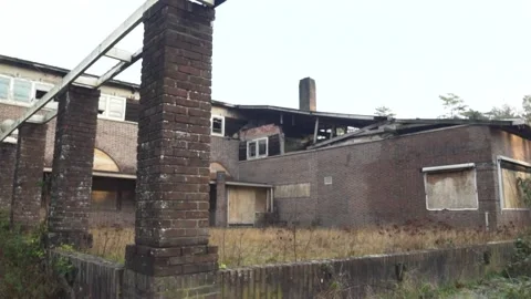 Camera panning over derelict building with destroyed roof Stock Footage 292924515