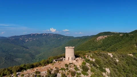 Camera panning over a medieval tower on a mountain top Video stock 282660506