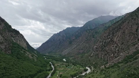 Camera panning over mountain valley river Stock Footage 289660786