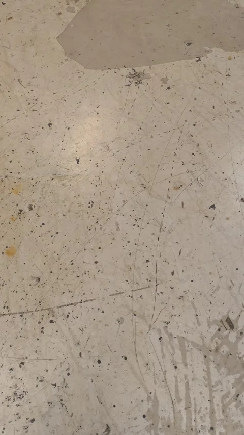 Camera panning over a scratched concrete garage floor texture Stock Footage 344981806