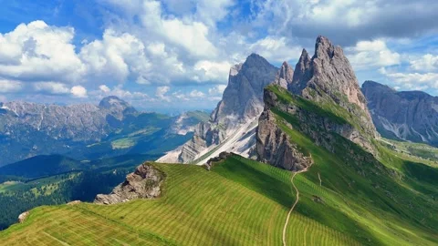 Camera panning over seceda mountain range in the italian dolomites Stock Footage 283296840