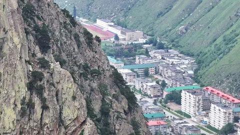 Camera panning over small town from mountainside Stock-Footage 289679999