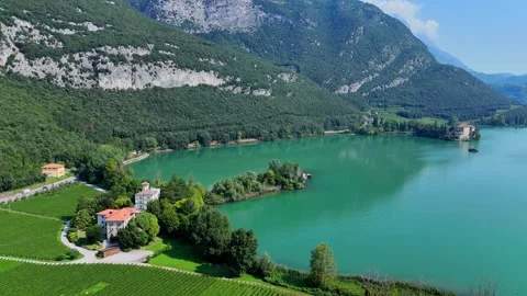 Camera panning over turquoise lake in italian alps Video stock 283293370