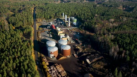 Camera panning over wood processing plant surrounded by forest, aerial view Stock Footage 289014647
