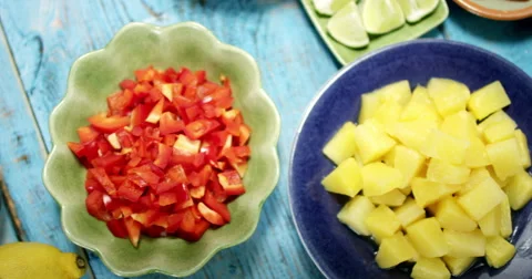 Camera panning past plates with taco ingredients Stock Footage 61535070