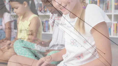 Camera panning revealing classmates tapping tablets for reading in library Stock Footage 311605280