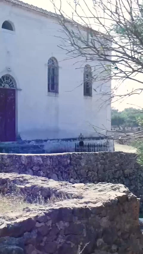 Camera panning revealing an old white church Stock-Footage 294963815