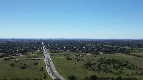 Camera panning right to left over the town of Bloemfontein with the N1 Highw Stock Footage 324800723
