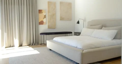 Camera panning right, revealing bedside table while bed remaining centered and Stock Footage 337237464