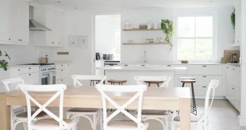 Camera is panning right, revealing full dining and kitchen area with six Stock Footage 345508858