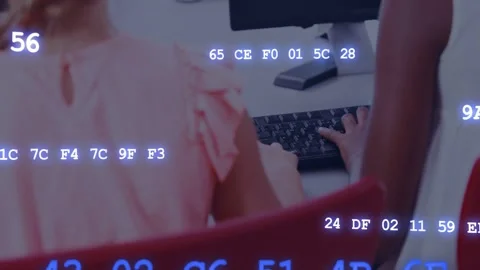 Camera panning right revealing students coding, typing on keyboards, hex codes Stock Footage 333234469