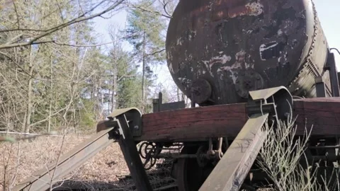 Camera panning right showing derailed tanker train car Stock Footage 293082874