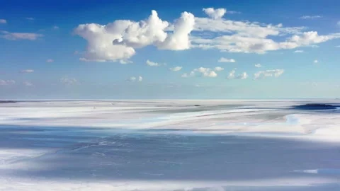 Camera panning to the right slowly. Shot of big salt lake. Blue sky with Stock Footage 156880093