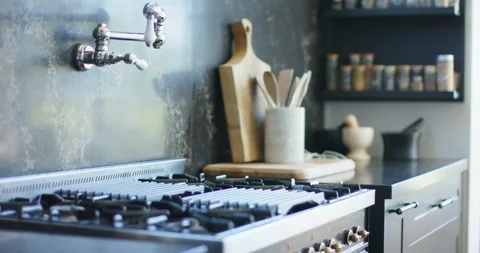 Camera is panning right as timer is starting, revealing steel range and spice Stock Footage 344340670